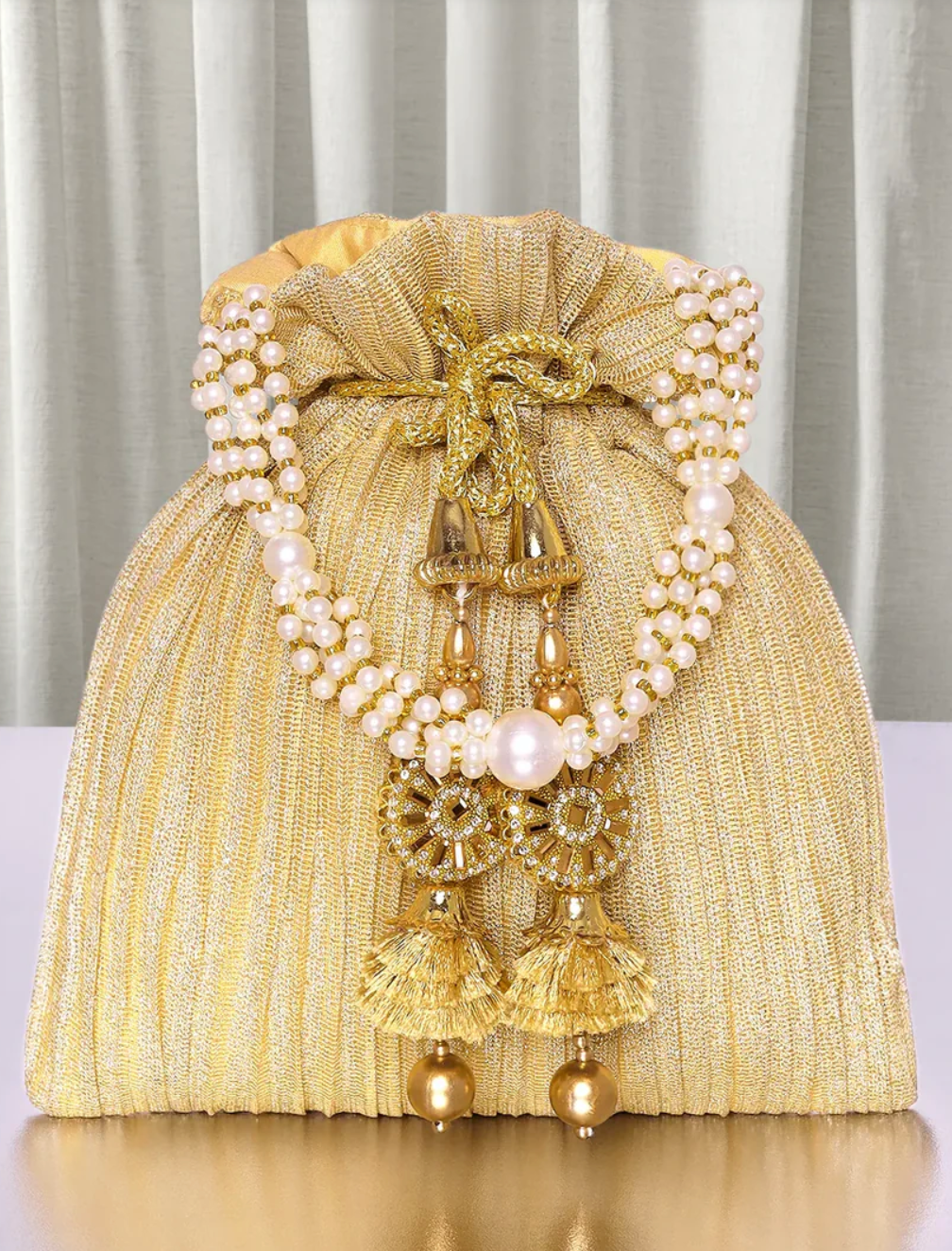 Golden Crinkle Potli Bag with Pearl and Tassel Embellishment